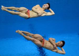 China's Qin Kai and Luo Yutong compete i