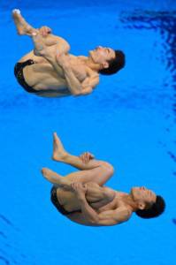 China's Qin Kai and Luo Yutong compete i