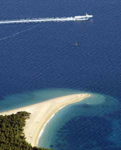 A ferry is passing by the most famous Cr