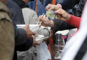 Homeless people receive charity soup noo