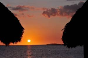 The sun sets behind the Seven Mile Bridg