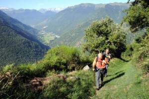 Men walk on a hiking trail at the Col de