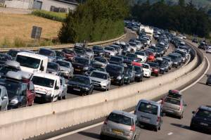 Vehicles drive in traffic jams on August