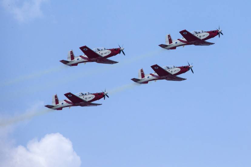 Israeli Efroni T-6 Texan II planes perform during an air show over the beach in the coastal city of Tel Aviv on April 23, 2015 as Israel marks Independence Day, 67 years since the establishment of the Jewish state. Israel's first prime minister David Ben-Gurion declared the existence of the State of Israel in Tel Aviv in 1948, ending the British mandate. AFP PHOTO / JACK GUEZ        (Photo credit should read JACK GUEZ/AFP/Getty Images)