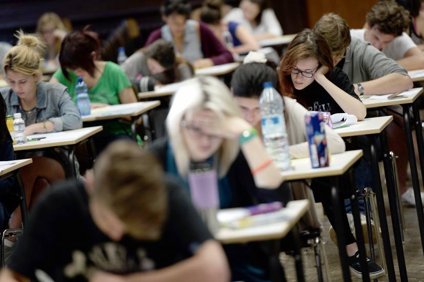 French students work on the test of philosophy as they take the baccalaureat exam (high school graduation exam) on June 16, 2014 at the Fustel de Coulanges high school in Strasbourg, eastern France. Some 686 907 candidates are registered for the 2014 session. AFP PHOTO/FREDERICK FLORIN        (Photo credit should read FREDERICK FLORIN/AFP/Getty Images)