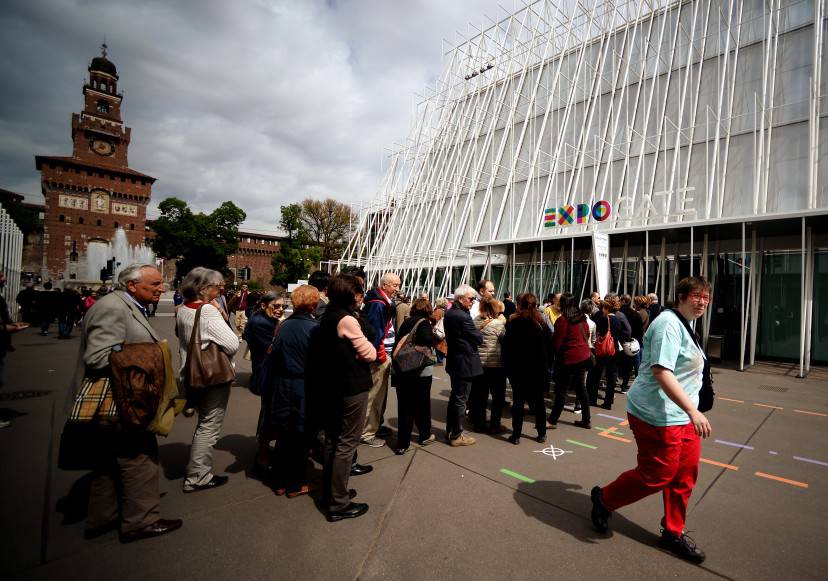 People queue for tickets to the Universal Exposition Milano 2015, EXPO2015, on April 29, 2015 in Milan. The exposition will run from May 1st, 2015 to October 31, 2015 on the theme of Feeding the Planet, Energy for Life. The fair focuses on food security, sustainable agricultural practices, nutrition and battling hunger - as well as dishing out the best fare of the world's culinary cultures. Cooking shows, restaurants, and food stalls will be designed to attract and hold visitors in Italy's financial capital. AFP PHOTO / FILIPPO MONTEFORTE        (Photo credit should read FILIPPO MONTEFORTE/AFP/Getty Images)