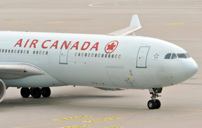 The plane of Air Canada, with German-Canadian arm dealer Karlheinz Schreiber on board, arrives at the airport of Munich, southern Germany on August 3, 2009. The 75-year-old will have to face tax evasion and bribery charges following a decade-long battle to avoid extradition, authorities said. Schreiber is accused of playing a key role in a sprawling slush-fund scandal that rocked the Christian Democratic Union (CDU) party in the 1990s and tarnished the legacy of former chancellor Helmut Kohl. AFP PHOTO  DDP/   JOERG KOCH      GERMANY OUT (Photo credit should read JOERG KOCH/AFP/Getty Images)
