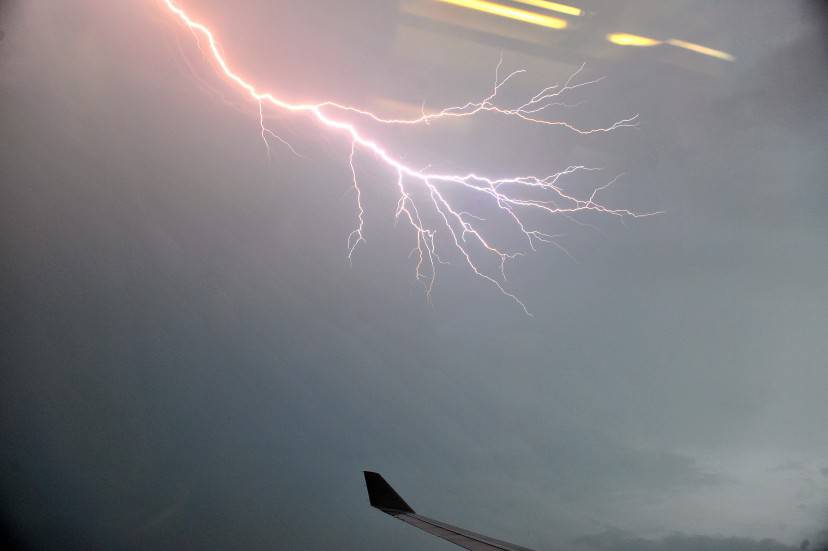 Lightning is seen through the window of the Malaysian Airlines plane over the Kuala Lumpur city on November 29, 2010.  Lightning is generally produced by thunderstorms, and occures through the discharge of charged electrons in the atmosphere.     AFP PHOTO / Saeed Khan (Photo credit should read SAEED KHAN/AFP/Getty Images)