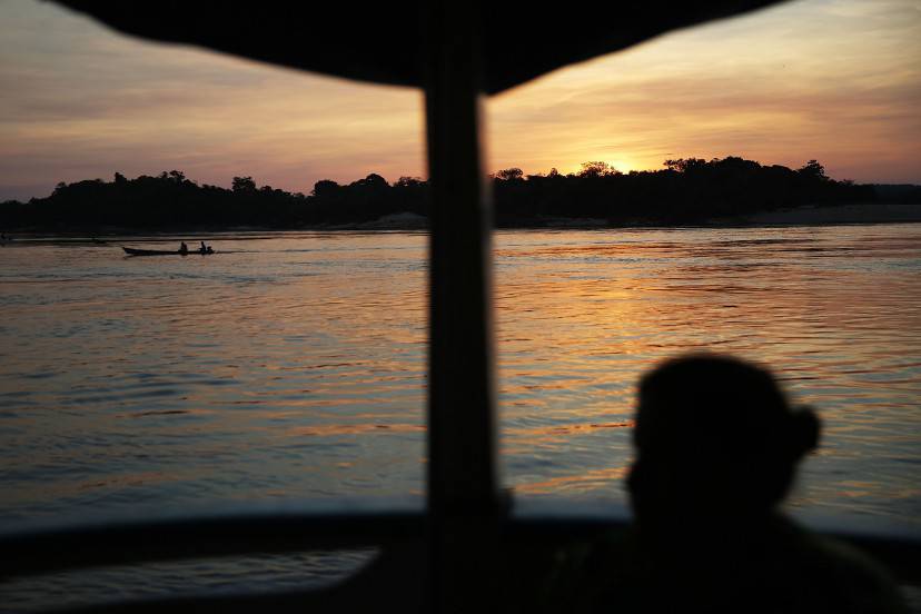 SAO LUIZ DO TAPAJOS, BRAZIL - NOVEMBER 26:  A boat travels along the Tapajos River during the 'Caravan of Resistance' protests staged by indigenous groups and supporters in opposition to plans to construct a hydroelectric dam on the Tapajos River in the Amazon rainforest on November 26, 2014 in Sao Luiz do Tapajos, Para State, Brazil. Indigenous groups and activists travelled by boat from communities along the river to the town to express resistance to the proposed 8.040- MW Sao Luiz do Tapajos mega-dam which is one of a series of five dams planned in the region that will flood indigenous lands and national parks. The United Nations climate conference is scheduled to begin December 1 in neighboring Peru.  (Photo by Mario Tama/Getty Images)