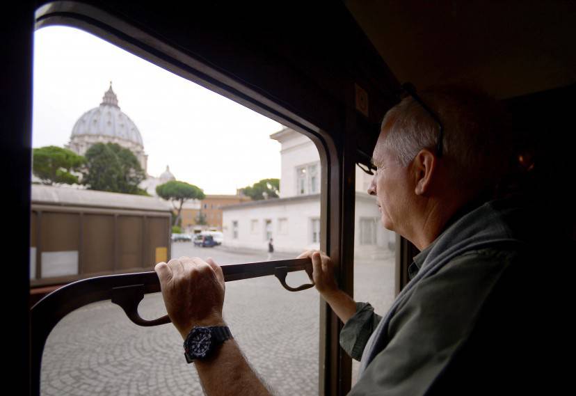 A man stands at a carriage window of a steam locomotive, looking through a window at the Saint Peter's Dome waiting for the train to leave the Vatican's train station to the pope's summer home of Castel Gandolfo on September 11, 2015 in Vatican City. Pope Francis has recently decided to open the link to visitors as well as part of pope's summer residence.        AFP PHOTO / FILIPPO MONTEFORTE        (Photo credit should read FILIPPO MONTEFORTE/AFP/Getty Images)