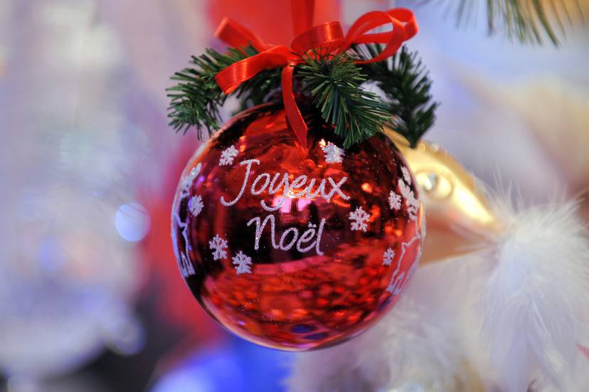 A Christmas ball reading " Merry Christmas" is seen on November 27 2010 during the opening of the Strasbourg Christmas market, which is the largest and one of the oldest French Christmas markets. With over 300 market chalets, Strasbourg attracts over 1.6 million visitors during the Christmas season. Beginning in 1570, Strasbourg opened its Christmas Market around its prestigious Cathedral. Since that time, its reputation in Europe has only increased, thanks to its merchant tradition as well as its spirit of tolerance and humanism that constitute its history and identity.  AFP PHOTO/FREDERICK FLORIN (Photo credit should read FREDERICK FLORIN/AFP/Getty Images)