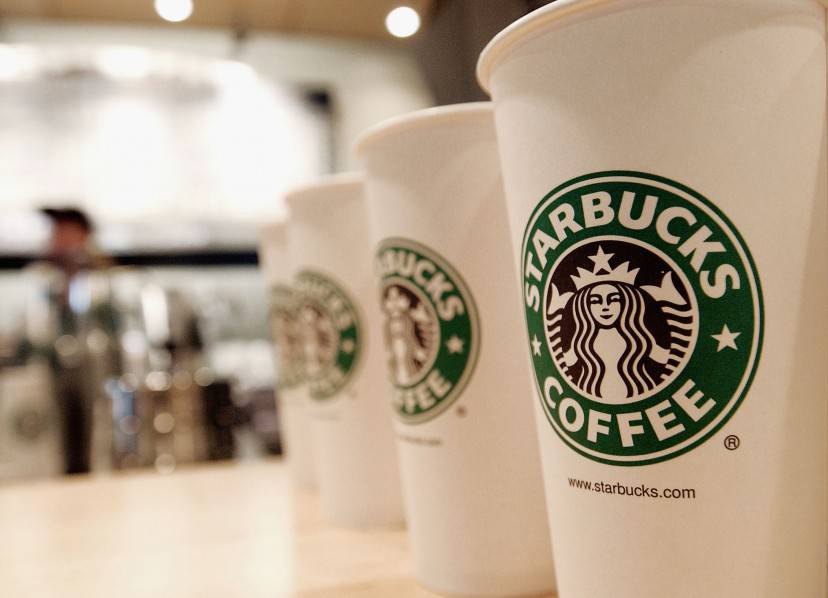 NEW YORK - AUGUST 5:  Beverage cups featuring the logo of Starbucks Coffee are seen in the new flagship store on 42nd Street August 5, 2003 in New York City. The Seattle-based coffee company has emerged as the largest food chain in the Manhattan borough of New York with 150 outlets.  (Photo by Stephen Chernin/Getty Images)