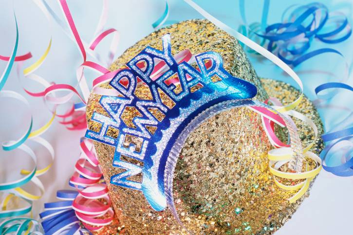 Sequined hat, tiara with Happy New Year sign, and streamers