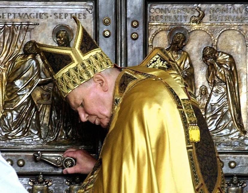 Pope John Paul II pauses moments before closing the holy door of Saint Peter's Basilica 06 January 2001 to symbolically wind up the Jubilee 2000 celebrations which coincided with the Catholic holy year. The door will remain sealed by a brick wall until 2025 when Catholics are expected to celebrate their next Holy Year. AFP PHOOTO MASSIMO SAMBUCETTI (Photo credit should read MASSIMO SAMBUCETTI/AFP/Getty Images)