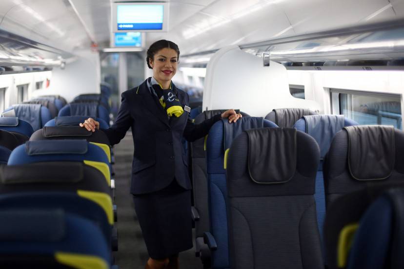 LONDON, ENGLAND - NOVEMBER 13: A stewardess poses for photographs on board Eurostar's new e320 train at St Pancras Station on November 13, 2014 in London, England. Launched today, the trains can reach speeds of up to 200mph and will get to Paris 15 minutes quicker than current trains. (Photo by Carl Court/Getty Images)