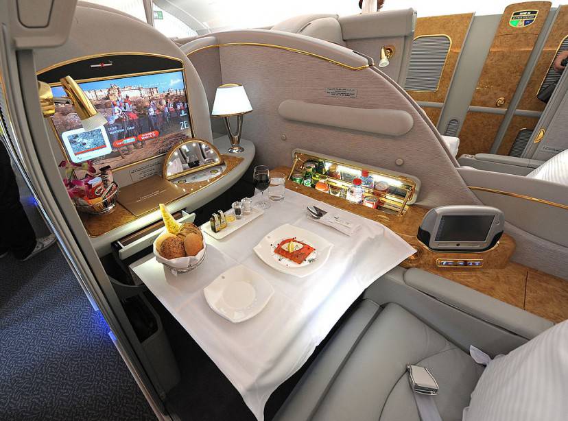 A fist class seat, set for lunch, is pictured on the upper deck of an Emirates Airbus A380, after it landed at Manchester Airport in Manchester, north-west England on September 1, 2010.   Manchester is the second airport in UK to start accepting the Airbus, after London Heathrow.     AFP PHOTO/ANDREW YATES (Photo credit should read ANDREW YATES/AFP/Getty Images)