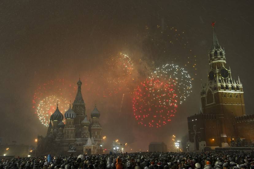 People gather to celebrate New Year's Eve on the Red Square in Moscow on January 1, 2011. New Year revellers around the planet began welcoming 2011 in a blaze of fireworks and parties Friday, temporarily banishing the misery of extreme weather that has struck across the world. AFP PHOTO/ DMITRY KOSTYUKOV (Photo credit should read DMITRY KOSTYUKOV/AFP/Getty Images)