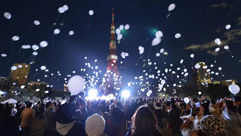 People release balloons to celebrate the New Year's during an annual countdown ceremony produced by the Prince Park Tower Tokyo, flagship of the Prince hotel chain in Tokyo on January 1, 2013. Some 1,000 balloons were released in the air with the visitors wishes. AFP PHOTO/ KAZUHIRO NOGI (Photo credit should read KAZUHIRO NOGI/AFP/Getty Images)