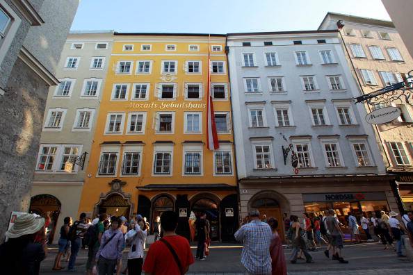SALZBURG, AUSTRIA - AUGUST 22:  The Getreidegasse street with the yellow house where Wolfgang Amadeus Mozart was born is pictured on August 22, 2010 in Salzburg, Austria. Salzburg, birthplace of composer Wolfgang Amadeus Mozart, is the fourth-largest city in Austria and the capital of the federal state of Salzburg.  (Photo by Miguel Villagran/Getty Images)