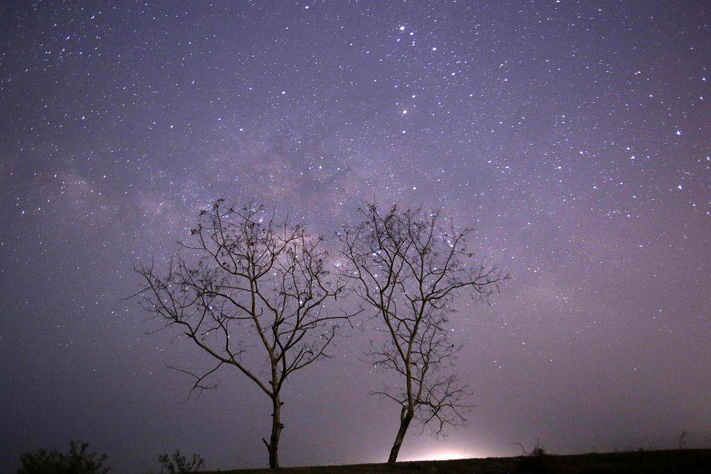 CORRECTION This long-exposure photograph taken on April 23, 2015 on Earth Day shows Lyrids meteors shower passing near the Milky Way in the clear night sky of Thanlyin, nearly 14miles away from Yangon. AFP PHOTO / Ye Aung Thu        (Photo credit should read Ye Aung Thu/AFP/Getty Images)