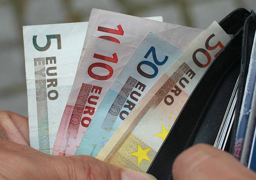 BERLIN, GERMANY - JUNE 21:  In this photo illustration a man removes Euro currency bills from a wallet on June 21, 2011 in Berlin, Germany. Eurozone finance ministers are currently seeking to find a solution to Greece's pressing debt problems, including the prospect of the country's inability to meet its financial obligations unless it gets a fresh, multi-billion Euro loan by July 1. Greece's increasing tilt towards bankruptcy is rattling worldwide financial markets, and leading economists warn that bankruptcy would endanger the stability of the Euro and have dire global consequences.  (Photo Illustration by Sean Gallup/Getty Images)