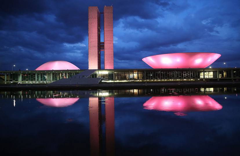 BRASILIA, BRAZIL - OCTOBER 27: The Brazilian National Congress building is lit at dusk on October 27, 2014 in Brasilia, Brazil. Brazil's left-wing President Dilma Rousseff was narrowly re-elected yesterday and will serve another four years in Brazil's unique planned capital city. The modernist city was founded in 1960 and replaced Rio de Janeiro as the federal capital of Brazil. The city was designed by urban planner Lucio Costa and architect Oscar Niemeyer and is now a UNESCO World Hertiage site. (Photo by Mario Tama/Getty Images)