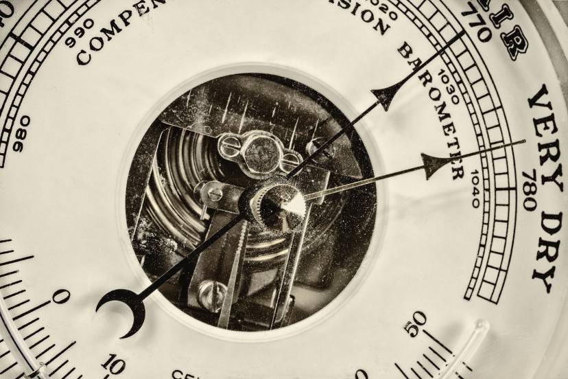 Retro styled close up image of an old barometer