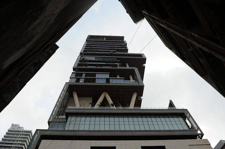 The twenty-seven storey Antilia, the newly-built residence of Reliance Industries chairman Mukesh Ambani, is seen in Mumbai on October 19, 2010. The 400,000 square foot residence, named after a mythical island in the Atlantic, is expected to be occupied by Ambani, his wife and three children later in the year. The building has three helicopter pads, underground parking for 160 cars, and requires some 600 staff to run. AFP PHOTO/Indranil MUKHERJEE (Photo credit should read INDRANIL MUKHERJEE/AFP/Getty Images)
