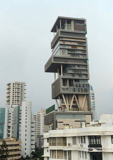 The twenty-seven storey Antilia, the newly-built residence of Reliance Industries chairman Mukesh Ambani, is seen in Mumbai on October 19, 2010. The 400,000 square foot residence, named after a mythical island in the Atlantic, is expected to be occupied by Ambani, his wife and three children later in the year. The building has three helicopter pads, underground parking for 160 cars, and requires some 600 staff to run. AFP PHOTO/Indranil MUKHERJEE (Photo credit should read INDRANIL MUKHERJEE/AFP/Getty Images)