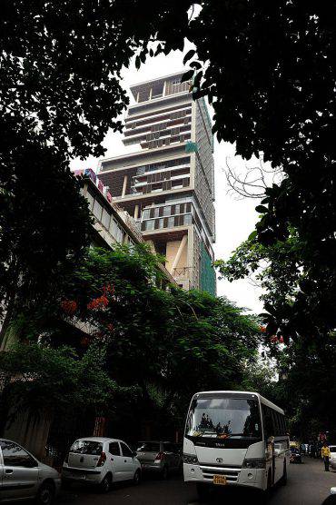 The twenty-seven storey Antilia, the newly-built residence of Reliance Industries chairman Mukesh Ambani, is seen in Mumbai on October 19, 2010. The 400,000 square foot residence, named after a mythical island in the Atlantic, is expected to be occupied by Ambani, his wife and three children later in the year. The building has three helicopter pads, underground parking for 160 cars, and requires some 600 staff to run. AFP PHOTO/Indranil MUKHERJEE (Photo credit should read INDRANIL MUKHERJEE/AFP/Getty Images)