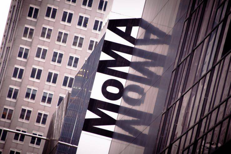 "New York, USA - Oct 1, 2011: Upward view of the exterior of the Museum of Modern Art in Manhattan, New York City. MoMA on the building's facial is an acronym of the name of the art gallery."