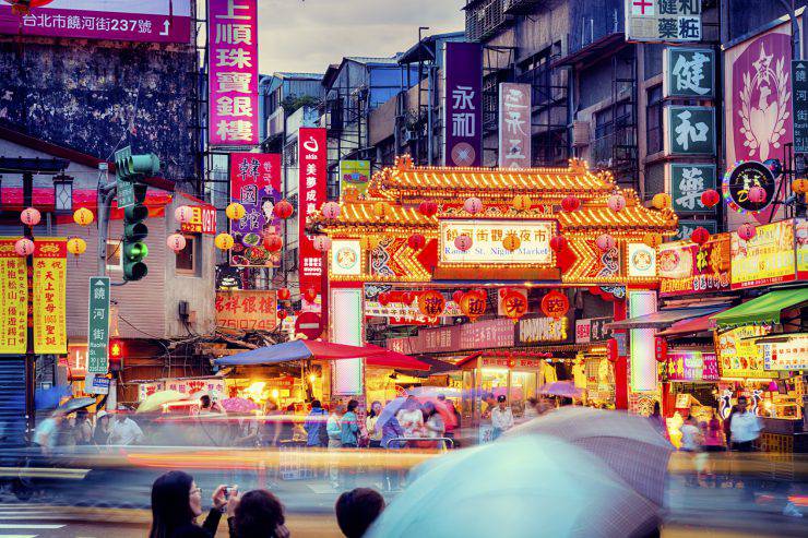 People gathering around Raohe Street Night Market in Taipei.