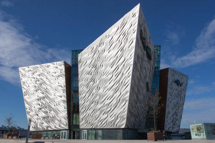 Belfast, Northern Ireland - October 13, 2012: Titanic Building in Belfast and people walking around.
