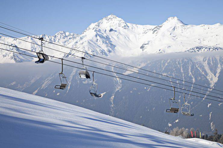 Ski lift on mountains background. Bormio, Italy.