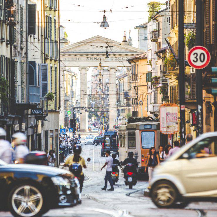 Evening time in busy streets of Milan, Italy.