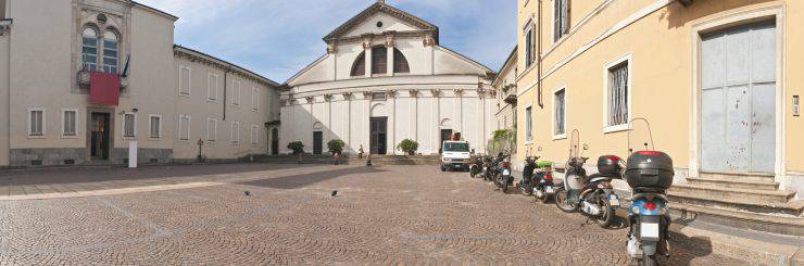 "Scooters parked on the piazza outside the Museo Nazionale della Scienza e della Tecnologia 'Leonardo da Vinci' and San Vittore al Corpo in the Magenta district of Milan, Lombardy, Italy. ProPhoto RGB profile for maximum color fidelity and gamut."