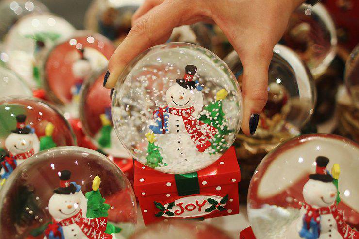 LONDON, ENGLAND - JULY 28:  An employee holds a decoration in the Christmas shop at Selfridges department store on July 28, 2011 in London, England. Selfridges launched its Christmas shop today, 149 days ahead of Christmas Day. Foreign tourists are those most likely to take advantage of the early opportunity to take back Christmas gifts.  (Photo by Dan Kitwood/Getty Images)