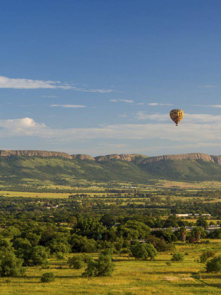 Hot Air Balloon in front of Magaliesberg Mountains, South Africa