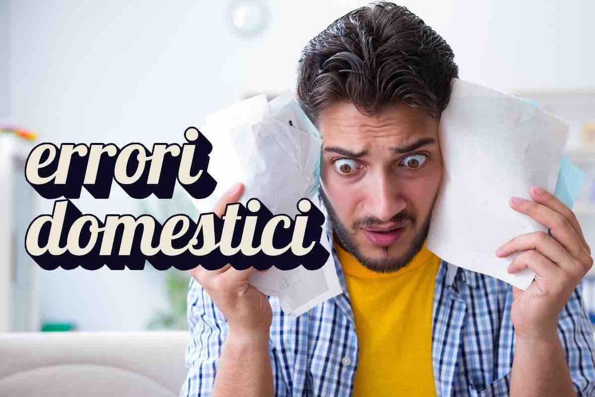 Uomo con bollette e scritta "errori domestici"