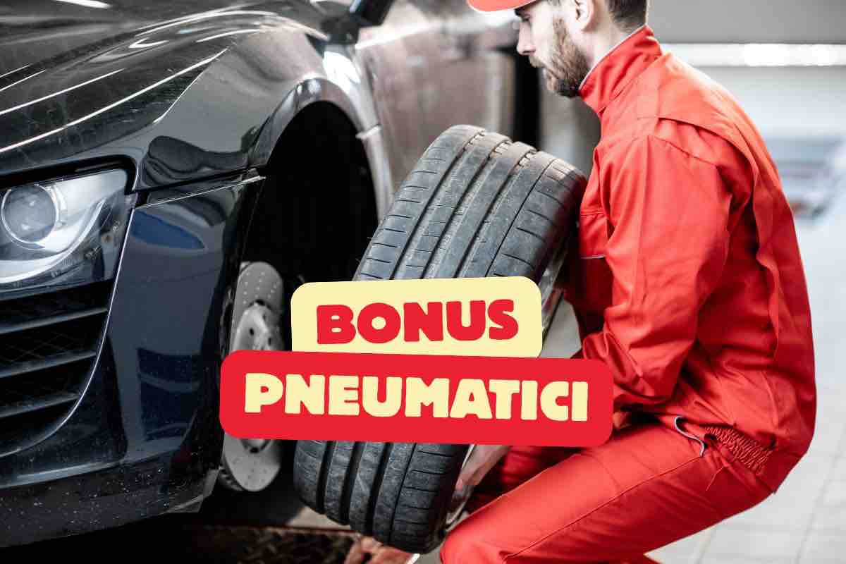 Meccanico che cambia gomme auto