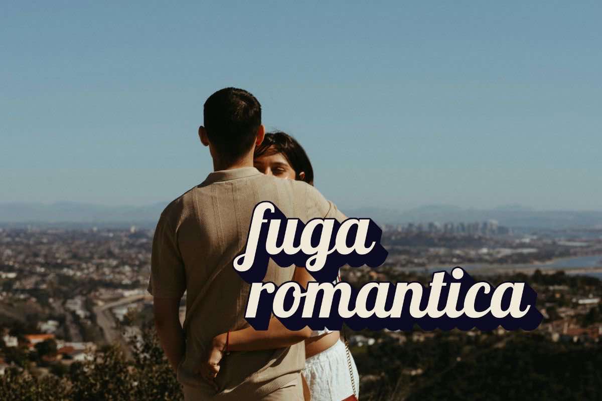 Coppia abbracciata e scritta "fuga romantica"