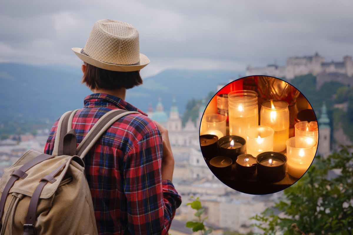 Donna che guarda l'orizzonte verso Salisburgo e candele