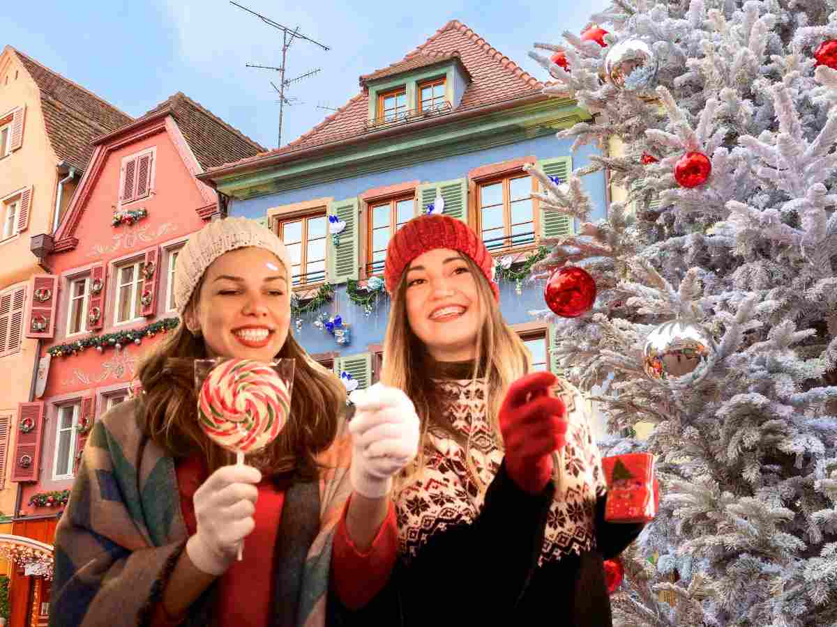 sfondo città europea a Natale e ragazze che passeggiano mangiando dolciumi