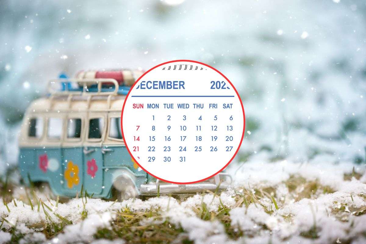 minivan nella neve e in primo piano pagina di calendario di dicembre